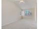 Large carpeted bedroom with ceiling fan and natural light from the windows at 9451 Natoma Station Pl, Las Vegas, NV 89123
