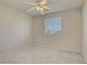 Comfortable bedroom featuring plush carpeting, a window, and ample natural light at 9451 Natoma Station Pl, Las Vegas, NV 89123