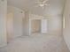 Carpeted bedroom with doorway to upper level, a window, and neutral paint at 9451 Natoma Station Pl, Las Vegas, NV 89123