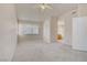 Carpeted bedroom featuring a window, en-suite access, and neutral paint at 9451 Natoma Station Pl, Las Vegas, NV 89123