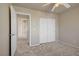 Cozy bedroom with plush carpet and a double door closet, offering comfort and functionality at 9451 Natoma Station Pl, Las Vegas, NV 89123