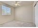Carpeted bedroom with window, closet, and neutral color scheme at 9451 Natoma Station Pl, Las Vegas, NV 89123
