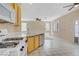 Kitchen featuring gas range and views of living area at 9451 Natoma Station Pl, Las Vegas, NV 89123