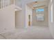 Neutral living room with staircase and high ceilings at 9451 Natoma Station Pl, Las Vegas, NV 89123