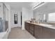 Spacious bathroom with double sinks, granite countertops, and a separate tub and shower at 1017 Huckburn Ave, Henderson, NV 89015