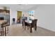 Bright dining area adjacent to the kitchen with modern stainless-steel appliances at 1017 Huckburn Ave, Henderson, NV 89015