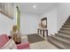Inviting foyer with a staircase, decor, and seating area creates a warm welcome at 1017 Huckburn Ave, Henderson, NV 89015