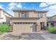 Charming two-story home with a two-car garage and stone accents at 1017 Huckburn Ave, Henderson, NV 89015
