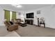 Comfortable living room features plush seating, a large television, and stylish decor at 1017 Huckburn Ave, Henderson, NV 89015