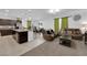 Open-concept living space featuring a kitchen, dining area, and cozy living room at 1017 Huckburn Ave, Henderson, NV 89015