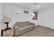 Inviting living room with a comfortable sofa, a decorative lamp, and plenty of natural light at 1017 Huckburn Ave, Henderson, NV 89015