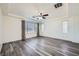 Bright bedroom with hardwood floors, modern ceiling fan, and plenty of natural light at 10428 Mulvaney Cir, Las Vegas, NV 89141