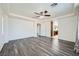 Large bedroom boasts ample space, walk-in closet, ensuite bathroom, and wood floors at 10428 Mulvaney Cir, Las Vegas, NV 89141