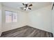 Bedroom featuring hardwood floors, a modern ceiling fan, and lots of natural light at 10428 Mulvaney Cir, Las Vegas, NV 89141