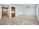 Bright open-concept living room features tile floors and a ceiling fan at 10428 Mulvaney Cir, Las Vegas, NV 89141