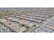 Expansive aerial view of a neighborhood of single-Gathering homes with mature landscaping and tile roofs at 10972 Dixie Johnson Ave, Las Vegas, NV 89166