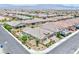 Aerial perspective of a single-story home featuring landscaped front and back yards in a community setting at 10972 Dixie Johnson Ave, Las Vegas, NV 89166