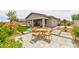 Backyard features a patio, garden, and artificial grass, providing a great space for entertaining at 10972 Dixie Johnson Ave, Las Vegas, NV 89166