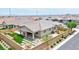 Charming backyard featuring a covered patio, artificial lawn, and desert landscaping for easy maintenance at 10972 Dixie Johnson Ave, Las Vegas, NV 89166