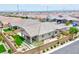 Inviting backyard with manicured lawn, patio area, and desert landscaping, perfect for outdoor living at 10972 Dixie Johnson Ave, Las Vegas, NV 89166