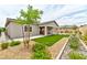Landscaped backyard featuring artificial turf and patio area ideal for outdoor activities at 10972 Dixie Johnson Ave, Las Vegas, NV 89166