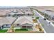 Beautifully landscaped backyard featuring desert plants, an artificial lawn, and a cozy patio area at 10972 Dixie Johnson Ave, Las Vegas, NV 89166