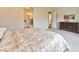 Comfortable bedroom with ensuite bath access; dresser with hardware at 10972 Dixie Johnson Ave, Las Vegas, NV 89166