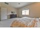 Large bedroom with view to a large window at 10972 Dixie Johnson Ave, Las Vegas, NV 89166