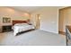 Bedroom with neutral walls and carpet, and view to the ensuite bath at 10972 Dixie Johnson Ave, Las Vegas, NV 89166
