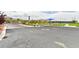 Gated community entrance features a playground, covered picnic area, and well-manicured landscaping at 10972 Dixie Johnson Ave, Las Vegas, NV 89166