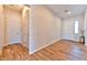 Foyer with wood-look tile flooring, featuring closet and front door at 10972 Dixie Johnson Ave, Las Vegas, NV 89166