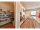 Spacious kitchen with a walk-in pantry, stainless steel appliances, and wood-look flooring at 10972 Dixie Johnson Ave, Las Vegas, NV 89166