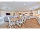 Open-concept living space features a dining area, kitchen, and cozy living room at 10972 Dixie Johnson Ave, Las Vegas, NV 89166