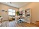 Bright home office with custom built-ins, wood floors, and a window view at 10972 Dixie Johnson Ave, Las Vegas, NV 89166