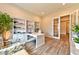 Spacious office area featuring custom built-ins and French doors leading to another room at 10972 Dixie Johnson Ave, Las Vegas, NV 89166