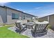 Relaxing backyard lounge area with a fire pit and comfortable seating, perfect for outdoor gatherings at 112 Springbough Ln, Las Vegas, NV 89138
