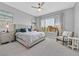 Serene primary bedroom suite with a large window and neutral decor at 112 Springbough Ln, Las Vegas, NV 89138