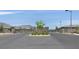 Gated community entrance with stone pillars and manicured landscaping, providing security and curb appeal at 112 Springbough Ln, Las Vegas, NV 89138