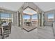 Open dining area featuring an outdoor kitchen, pergola, patio, and lots of natural light at 112 Springbough Ln, Las Vegas, NV 89138