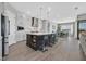 Modern kitchen with stainless steel appliances, a large island, and breakfast bar seating at 112 Springbough Ln, Las Vegas, NV 89138