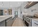 Contemporary kitchen featuring stainless steel appliances, white cabinets, and a gas range at 112 Springbough Ln, Las Vegas, NV 89138