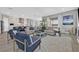 Open-concept living room flowing into the kitchen and dining area, with designer furnishings at 112 Springbough Ln, Las Vegas, NV 89138
