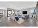 Spacious living room with modern fireplace, hardwood floors, and plenty of natural light at 112 Springbough Ln, Las Vegas, NV 89138