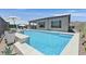 Stunning backyard oasis with a sparkling pool and sun loungers offering a tranquil retreat at 112 Springbough Ln, Las Vegas, NV 89138