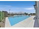 Resort-style pool with a Baja shelf, and lush landscaping, perfect for relaxation and enjoyment at 112 Springbough Ln, Las Vegas, NV 89138