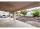 Covered patio with ceiling fans, offers a relaxing outdoor space overlooking the backyard at 1206 Evening Canyon Ave, Henderson, NV 89014