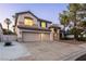 Charming two-story home featuring a three car garage and well-maintained landscaping at 1206 Evening Canyon Ave, Henderson, NV 89014