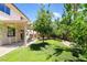 Lush backyard with pergola, trees, and grass, perfect for outdoor entertaining and relaxation at 1371 Cumulus Ct, Henderson, NV 89014