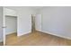 Bedroom featuring an open closet and wood-look flooring at 1371 Cumulus Ct, Henderson, NV 89014