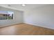 Bedroom featuring a window, light and bright walls and wood-look flooring at 1371 Cumulus Ct, Henderson, NV 89014